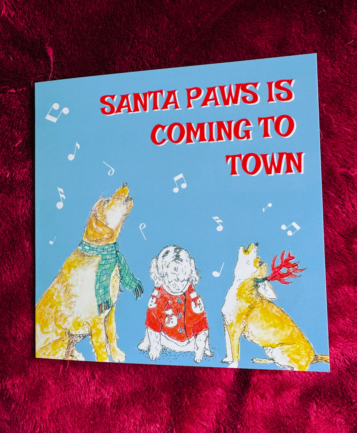 Funny festive dogs Christmas card - ‘Santa Paws is coming to town’