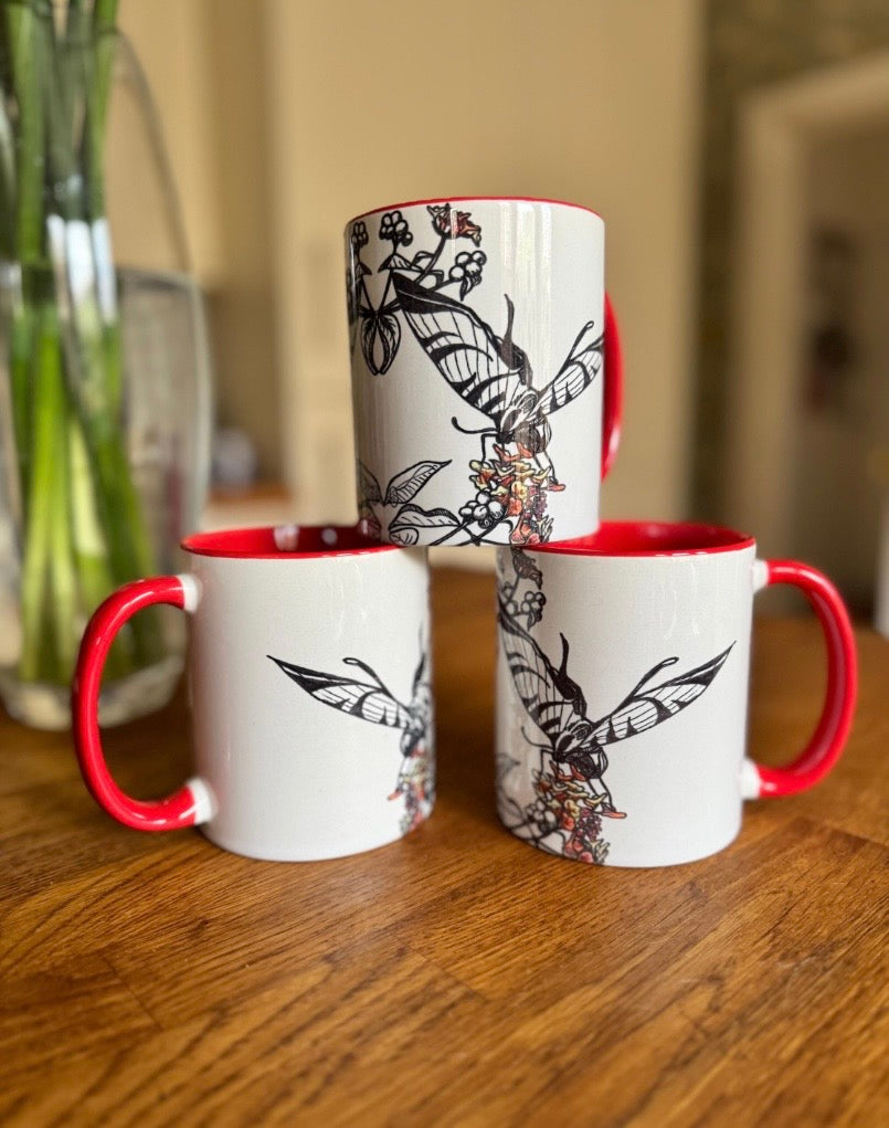 Butterfly coffee mug with bright red handle and interior
