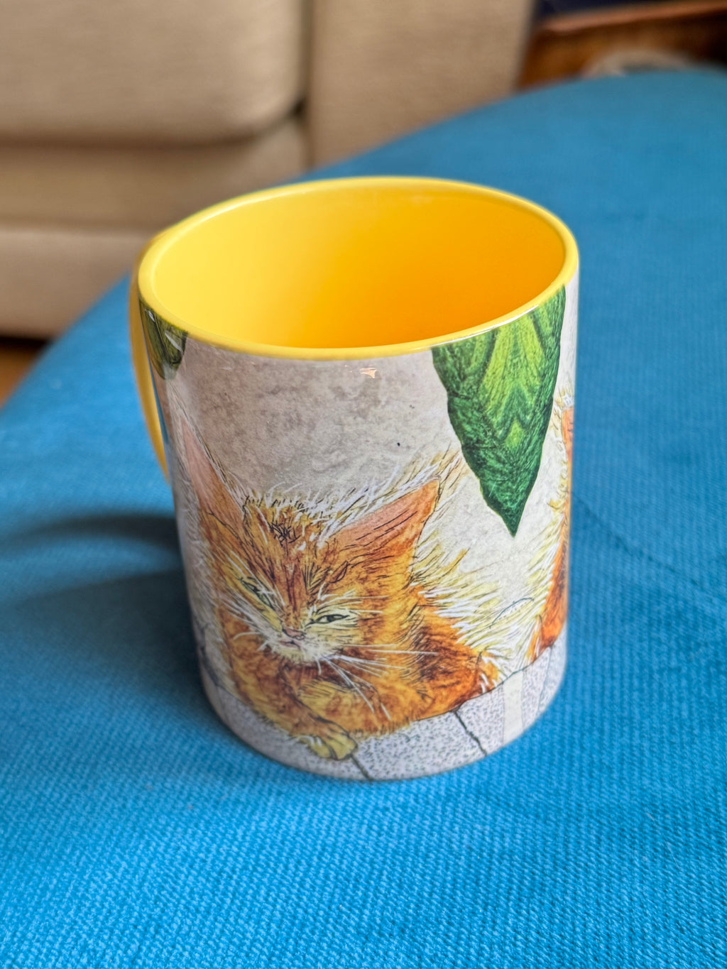 Ginger kitten coffee mug with yellow handle and interior